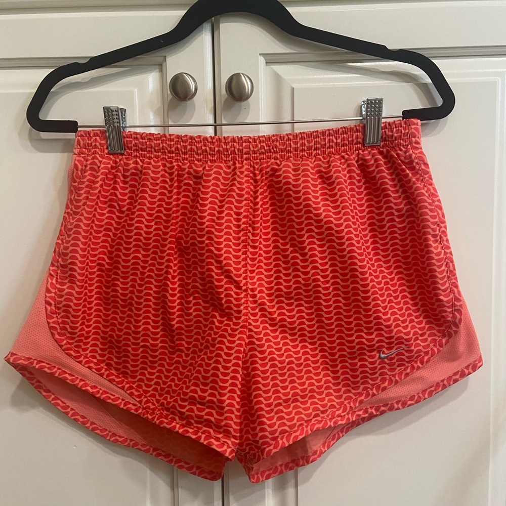 Women’s Nike running shorts dri fit size medium coral pink and orange color